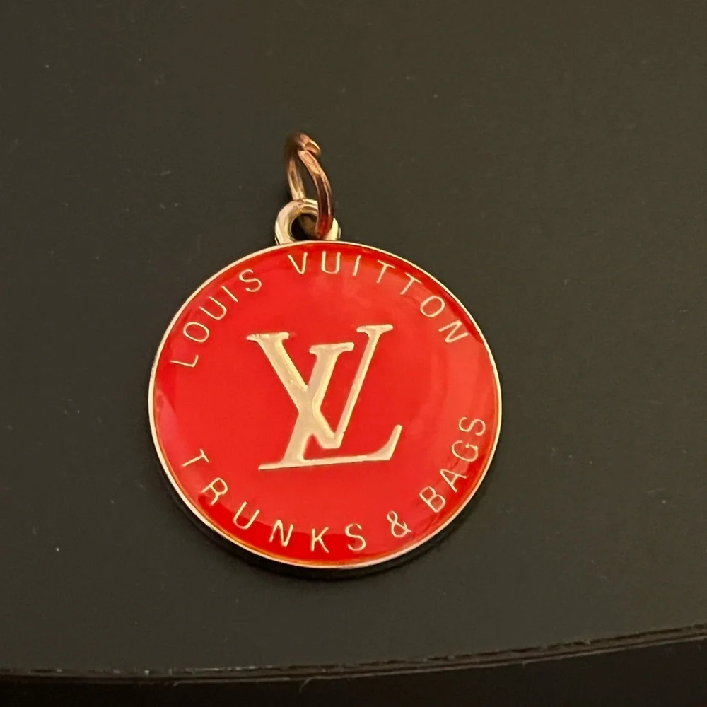 Louis Vuitton zipper pull/charm. Coral color 1” long